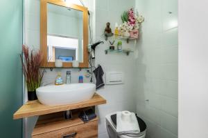 a bathroom with a sink and a mirror at all u need 4 holiday - fewo44 in Mühlthal +16 photos