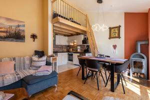 a living room with a couch a table and a kitchen at all u need 4 holiday - fewo44 in Mühlthal