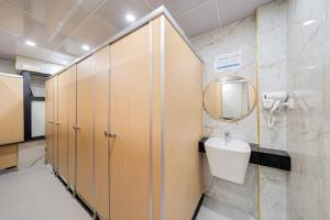 a bathroom with a toilet and a sink at 2Re Hidden Hostel 58 Hàng Bạc in Hanoi +30 photos