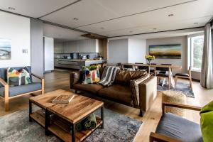 a living room with a couch and a table at Bayview 203 in Hermanus
