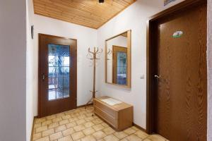 a room with a door and a box and a mirror at Ferienwohnung Haus Barbara in Bräunlingen +16 photos