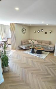 a living room with a couch and a table at Justinos Vila in Palanga