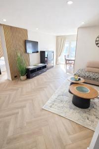 a living room with a couch and a table at Justinos Vila in Palanga