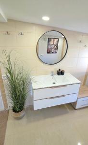 a bathroom with a white sink and a mirror at Justinos Vila in Palanga +56 photos