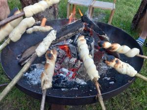 a grill with a bunch of food on it at Raffreiderhof Apt Fichte in Luson