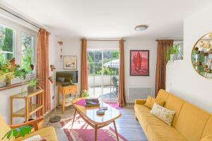 a living room with a couch and a table at Casa Lago - Selão da Eira in São Teotónio