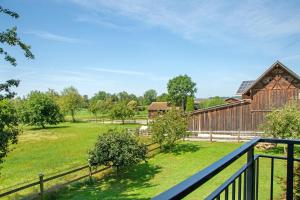 a view of the farm from the balcony of a barn at Ferienwohnungen Hackerhof in Bad Füssing