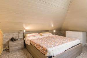 a bedroom with a large bed in a room at Residence Gigi Complex Manerba in Manerba del Garda