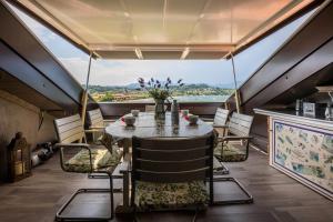 a dining room with a table and chairs at Residence Gigi Complex Manerba in Manerba del Garda +12 photos