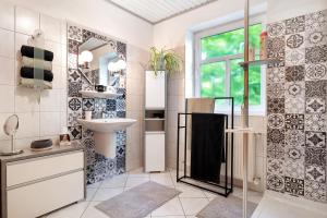 a bathroom with a sink and a mirror at Inge Huus in Hude +25 photos