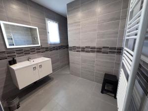 a bathroom with a sink and a mirror at Villa Lucia in Narbonne +20 photos