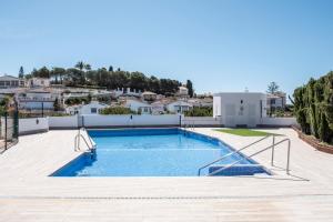 a swimming pool in the backyard of a house at Casa Lagos - 046 in Caleta De Velez