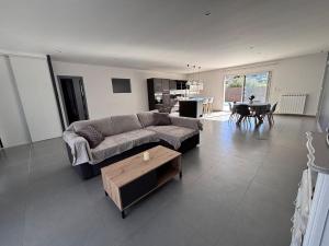 a living room with a couch and a table at Villa Lucia in Narbonne