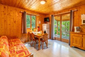 a kitchen and dining room with a table and chairs at Gite Thym in Mirabel-aux-Baronnies