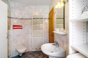 a bathroom with a sink and a toilet at Huus Nördernee 1 in Norderney +19 photos
