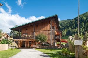 a large wooden house in the mountains at Naturidyll Mitterbach in Rio Bianco