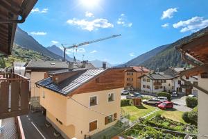 a view of a town with mountains in the background at Casa Cecilia tra Bormio e Livigno in Valdidentro