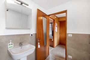 a bathroom with a sink and a mirror at da Lule in Aosta +14 photos