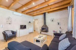 a living room with a couch and a fireplace at Sa Sargantana in Islas Baleares