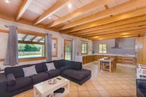 a living room with a couch and a table at Sa Sargantana in Islas Baleares