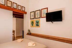a room with a flat screen tv on the wall at Cantina Rustica in Montallegro