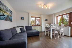 a living room with a couch and a table at Apfelhof Maurer in Lindau
