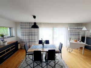 a dining room with a table and chairs at Luxury Villa Vienna in Mauerbach