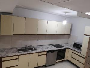 a kitchen with a sink and a counter top at Ferienwohnung In Krumbach in Krumbach