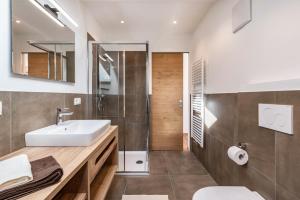 a bathroom with a sink and a shower at Balbeinhof Apt Gams in Luson +28 photos