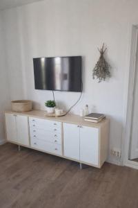 a tv on top of a cabinet in a room at Maria Isabelles boende nr 3 in Fjugesta