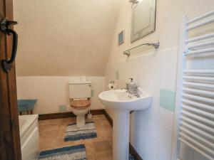a bathroom with a toilet and a sink at Cider Cottage - near Lyme Regis in Axminster +36 photos