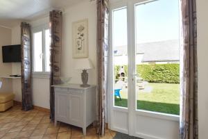a room with a door leading to a yard at Gite Les Salicornes in Lanchères