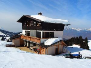 a house on top of a snow covered mountain at Chalet d' Egloo 10-12 pers in Samoëns +7 photos