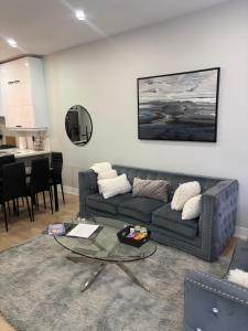 a living room with a couch and a table at The Millertime Experience in Brantford