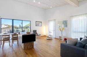 a living room with a couch and a tv in it at Ferienwohnungen Walz in Pfullendorf