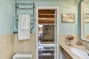 a bathroom with a sink and a mirror at Designer House With Panoramic views in Cadaqués +24 photos