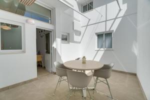 a dining room with a table and chairs at Serenity in Arona +17 photos