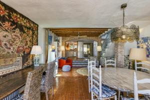 a dining room with a table and chairs at Designer House With Panoramic views in Cadaqués