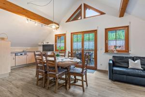 a kitchen and dining room with a table and chairs at Haus Sum in Oberwolfach