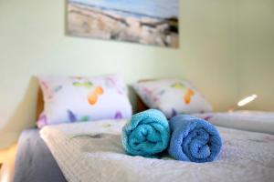 a stuffed animal is laying on a bed at Apartment Eulenhof 1 in Bordelum