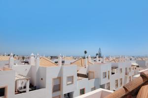 a view of the roofs of white buildings at Quinta Gomeira 146 in Cabanas de Tavira