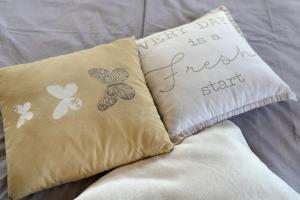 a pillow with a happy new day is a new start at Gästesuite mit Sauna in Kehl am Rhein