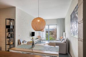 a living room with a table and a dining room at Ferienwohnung Zwei in Saal