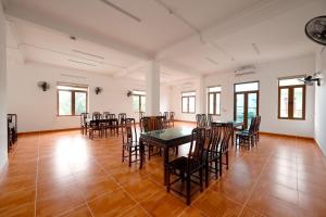 a large room with a table and chairs at South Star Hotel in Ninh Binh