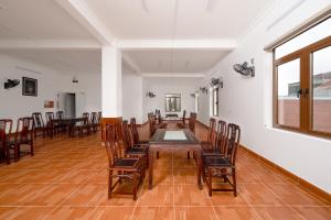an empty room with a table and chairs in it at South Star Hotel in Ninh Binh