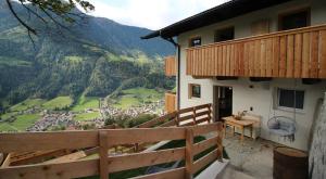 a balcony of a house with a view of a village at Bergchalet Prantach in San Martino