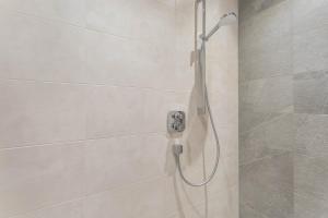 a shower with a shower head in a bathroom at Luisalle Top 1 in Auffach +20 photos