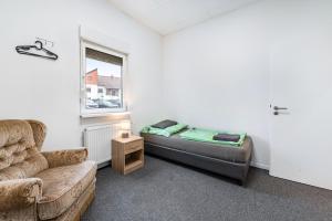 a living room with a couch and a window at Saarglück - W4 in Beckingen