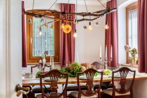 a dining room with a long table with chairs at Apartment Villa Stumm in Stumm