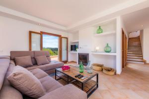 a living room with a couch and a table at Can Bosco in Son Servera